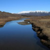 Iceland.  Oxara River in Thingvellir National Park: A beautiful clear spring day.  Taken on a footbridge over the river.