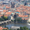 View of Old Town Prague from Petrin Tower: An overview including the historic Charles Bridge and Vltava River