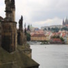 Charles Bridge, Prague: Prague Castle and the spires of St. Vitus Cathedral in the background (R).