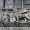 Venice -- Doge Palace entrance details: A detail of the entryway, the leader kneeling before the winged lion, symbol of Venice
