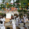 Anuradhapura -- Bodhi tree: Prayer flags and pilgrims
