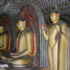 Dambulla -- interior Buddha statues: The cave walls are beautifully painted.