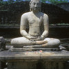Polonnaruwa -- Vatadage: Another statue of the Buddha, again with the small stupa behind it.