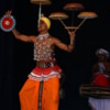 Kandy -- balancing act at the Cultural Show: A delicate balancing act. I think in total he had 10 baskets spinning.