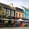 Colorful shops of Kenmare: Some of the Market stalls are in the foreground