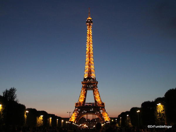 Eiffel Tower lite up at Dusk, photographed from Champ de Mars
