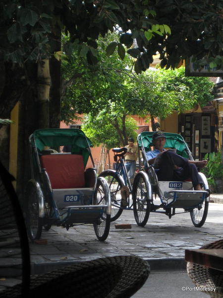 Rickshaw drivers having a break.