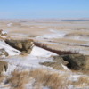 Head-Smashed-In-Buffalo Jump viewed from Top: The Porcupine Hills transition into a vast expanse of prairie.