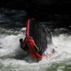 Upside down on Clark Fork River: There they go! The river tipping the raft