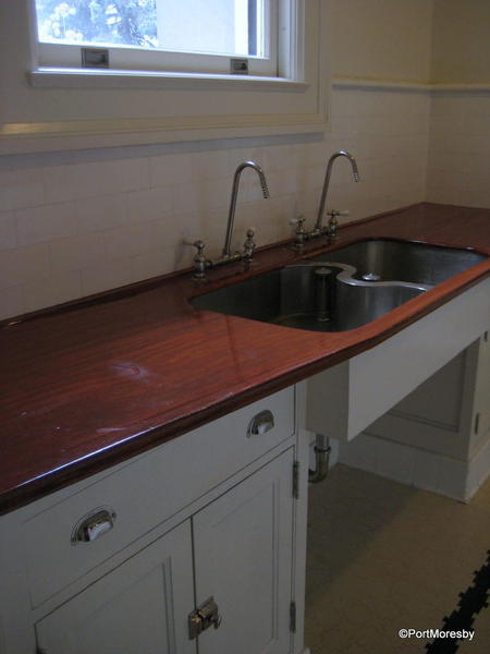 Kitchen with intriguing sink design.