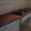 Kitchen with intriguing sink design.