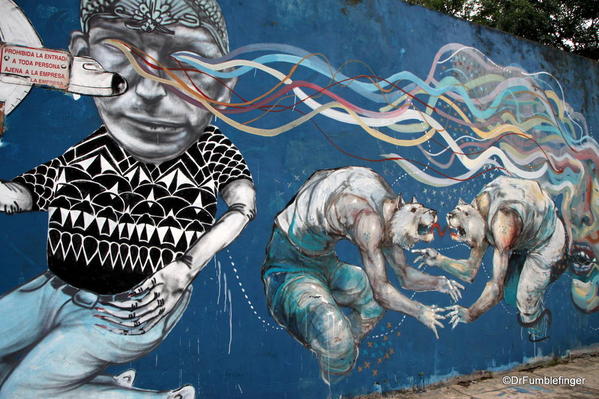 Street art on Charcarita walls. Tiger-Football player hybrids by Jaz