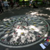 The circular pathway mosaic of inlaid stones containing the word "Imagine".: This is the focal  point of Strawberry Fields, Central Park, New York, New York.