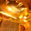 Reclining Buddha, Wat Po, Bangkok, Thailand: Close-up of the face resting on his right hand