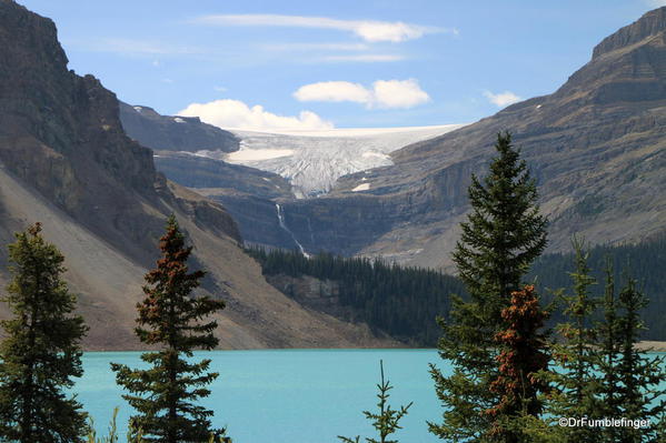 Bow Glacier Falls seen at a distance, draining Bow Glacier. Bow Lake is in the foreground