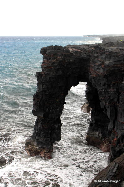 Volcanoes National Park. Holei Sea Arch: a natural arch, pounded by the powerful surf. Chain of Craters Road