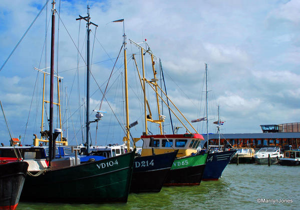 Sailing vessels are moored in Volendam's harbor