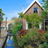Picturesque houses line narrow canals in Volendam
