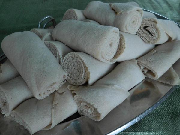 A stack of rolled injera--looking like napkins!