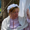 Costumed interpreters go about their chores as if it was the 17th or 18th century