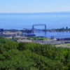 View from Enger Tower: Looking northeast, we see the entertainment district of Canal Park, the iconic Aerial Lift Bridge which marks the entrance to Duluth Harbor Basin, the Duluth Entertainment Convention Center, the Great Lakes Aquarium, and Bayfront Festival Park.