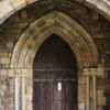 Entrance door: Norman pointed arch.