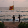 Lowering the flag at sunset, Galle Face Hotel