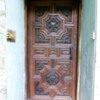 The ornately carved door leads the way to the antiquities therein