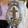 Inside the silver reliquary are two pieces of wood said to be part left arm of the "True Cross"