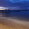 Beach and pier - glimmers of sunset.