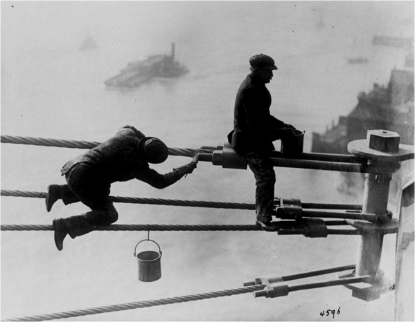 Brooklyn_Bridge_painters_at_work_high_above_New_York_City,_on_03_December_1915