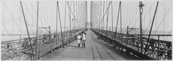 Pedestrians_on_the_upper_deck_promenade_of_Brooklyn_Bridge,_New_York_City,_ca._1910_-_NARA_-_541908.tif
