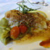 Grilled Antarctic sea bass fillet with mashed peas and confit tomatoes