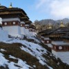 Chortens with snow at the Dochula Pass
