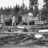 1280px-Canoes_and_a_boathouse_at_Brockton_Point_1897