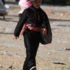 It's Carnival in Catania and the kids are all wearing costumes.  The young Zorro know's it's not just the costume -- it's the attitude!