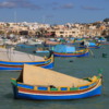 Fishing village of Marsaxlokk, Malta.  These are traditional styled Maltese boats