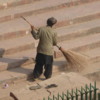 Sweeping the steps of the  Jama Jasjid, Old Delhi
