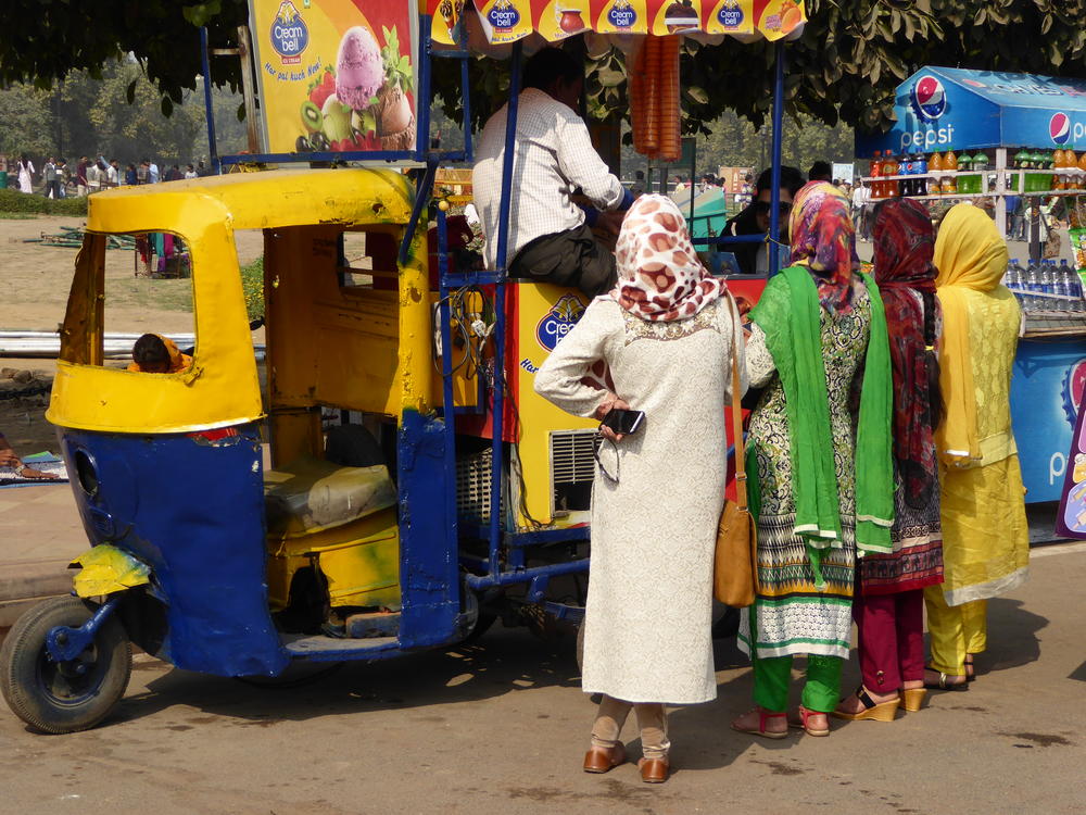 Some young women deciding on which treat to get, New Delhi