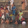 Pilgrims take a morning plunge into the purifying waters of the Ganges River, Varanasi