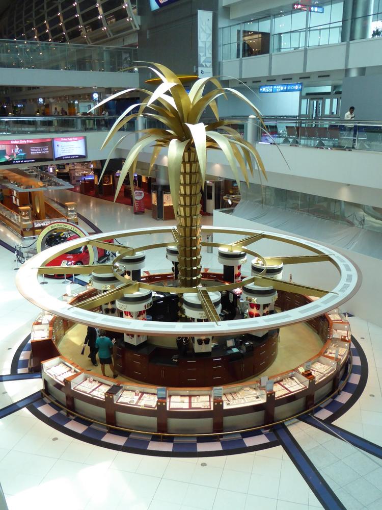 This golden palm tree shades a gold jewelry shop, Dubai International Airport