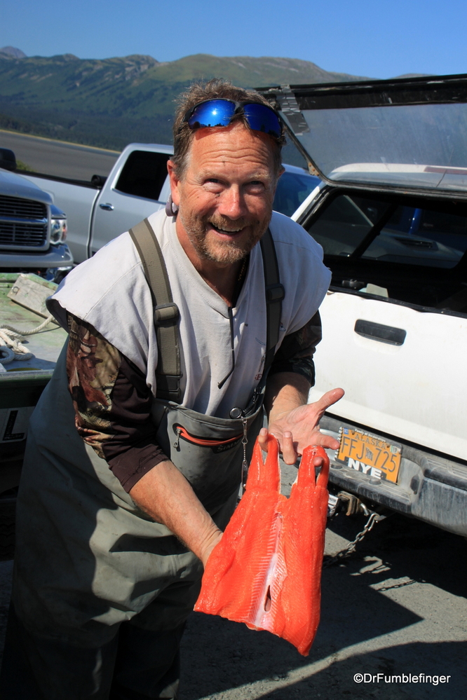 A proud (amateur) Alaska fisherman showing one of his beautiful Coho salmon fillets at 20 Mile River