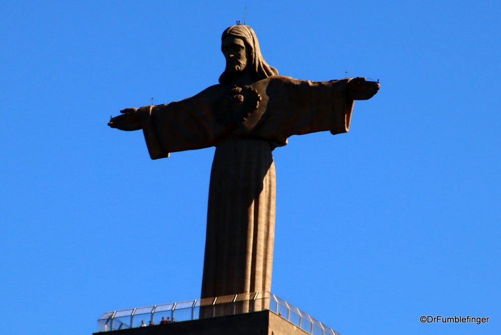 Tall Cristo Rei statue across the river from Lisbon